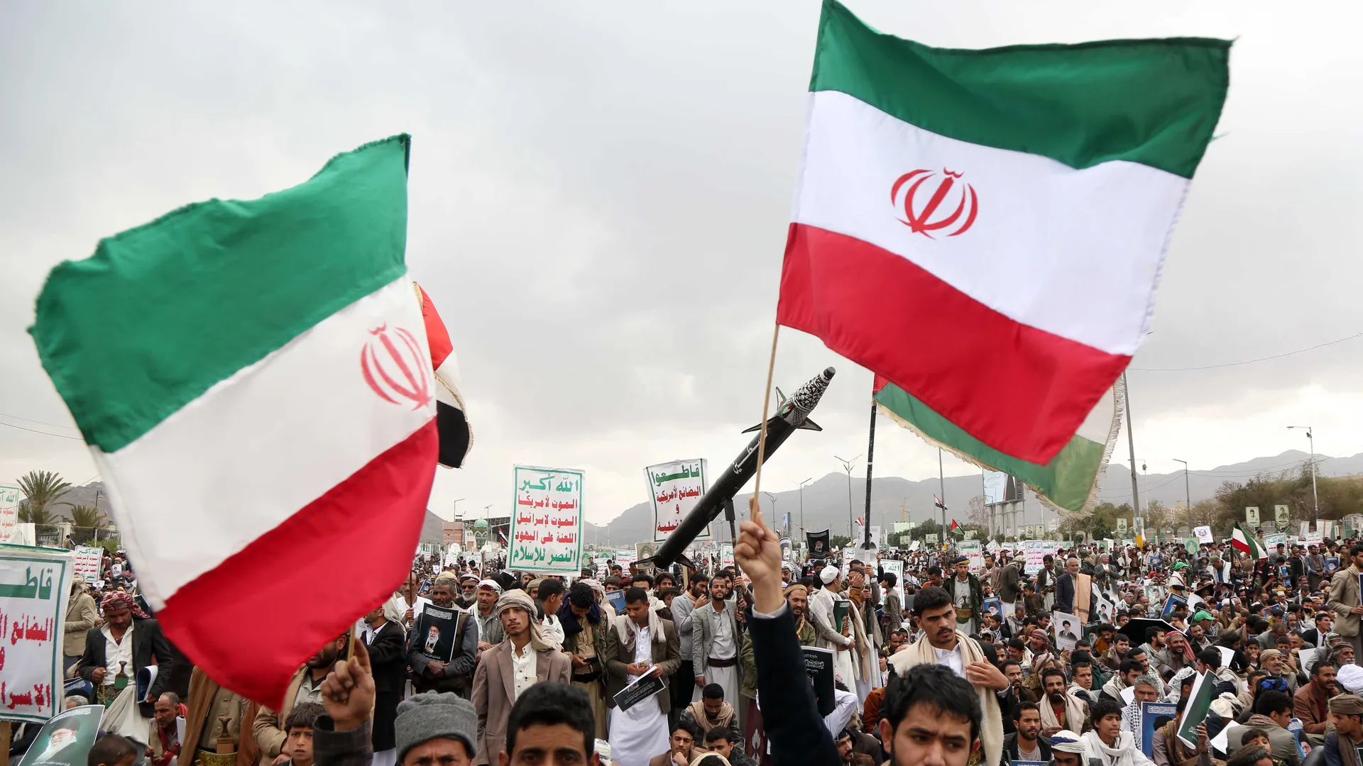 Emerging market economies face rising trade costs and inflation from the Iran war Title: Shipping containers at an Indian port amid rising war surcharges and trade disruptions